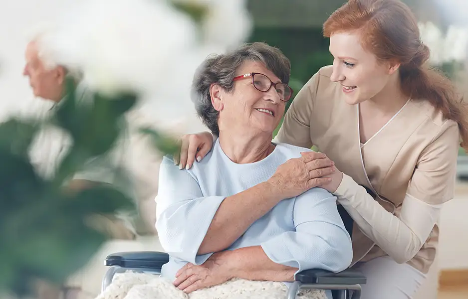 a young woman comforting an older woman